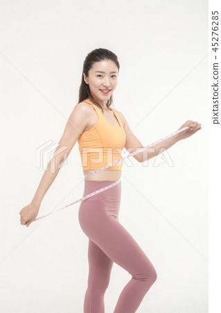 A Korean woman with a waist on a tape measure 45276285