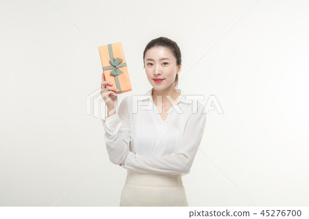 A woman who is delighted to receive a gift A woman who is delighted to receive a gift 45276700