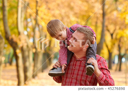 Happy family and children are in autumn city park Happy family and children are in autumn city park 45276898