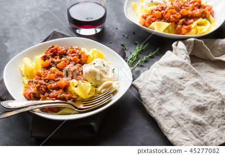 Pappardelle pasta with ragout and burrata cheese 45277082