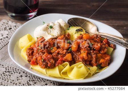 Pappardelle pasta with ragout and burrata cheese 45277084
