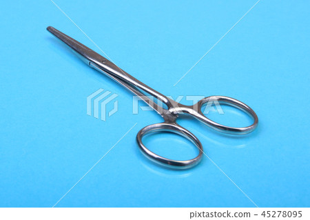 Close Up Surgical instruments and tools on blue mirror background. Selective focus. Close Up Surgical instruments and tools on blue mirror background. Selective focus. 45278095