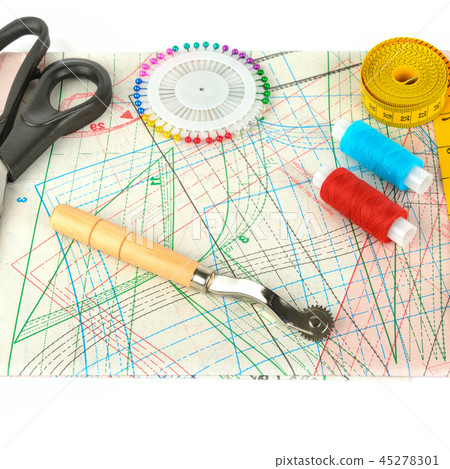 Sewing accessories and paper pattern isolated  45278301