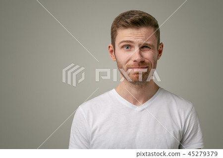 A nervous doubtful male frowning eyebrow A nervous doubtful male frowning eyebrow 45279379