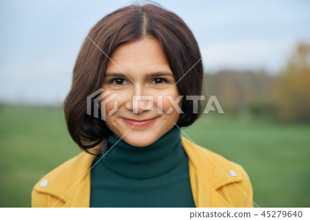 Portrait of a smiling girl in the Park. Portrait of a smiling girl in the Park. 45279640