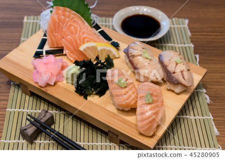 Mixed salmon sushi on wooden plate Mixed salmon sushi on wooden plate 45280905