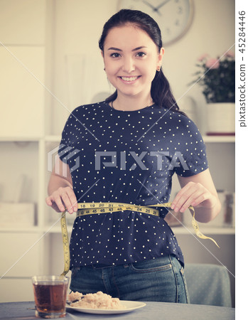 Woman happy to lose weight Woman happy to lose weight 45284446