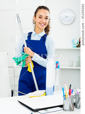 Woman with supplies cleaning in office 45285082