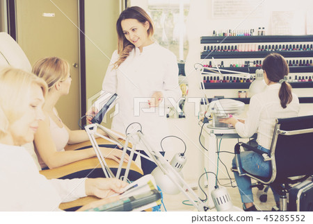 Girl doing nails displaying her workplace 45285552