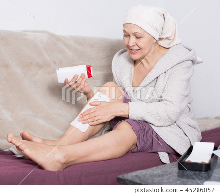 Woman doing body hair removal Woman doing body hair removal 45286052