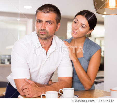 Woman calming distressed husband Woman calming distressed husband 45286112