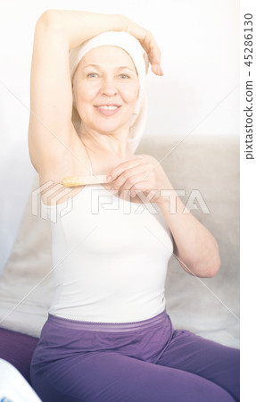 Woman doing body hair removal Woman doing body hair removal 45286130