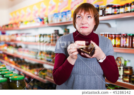 customer with wallet counting money in supermarket customer with wallet counting money in supermarket 45286142