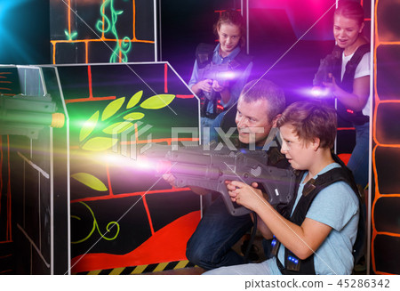 Cheery boy and his father aiming laser guns Cheery boy and his father aiming laser guns 45286342