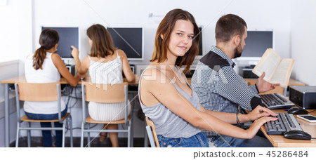 Female student studying in computer class Female student studying in computer class 45286484