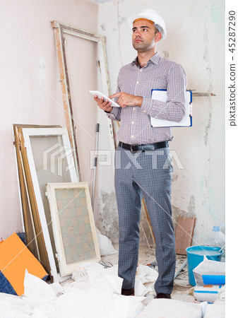 Man engineer talking on the mobile phone Man engineer talking on the mobile phone 45287290