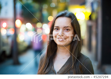 Closeup portrait of woman outdoors 45287294