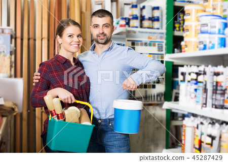 Designers with paint instruments in store 45287429