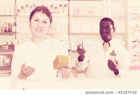 woman apothecary offering medication woman apothecary offering medication 45287430