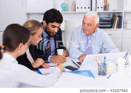 Office workers are writing financial reports Office workers are writing financial reports 45287462