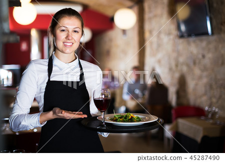 Waitress with serving tray Waitress with serving tray 45287490