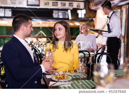 Lovely couple is dining together Lovely couple is dining together 45287688