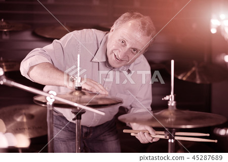Man is choosing drum set Man is choosing drum set 45287689