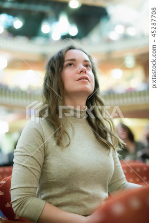 Carefree woman relaxed theatre performance 45287708