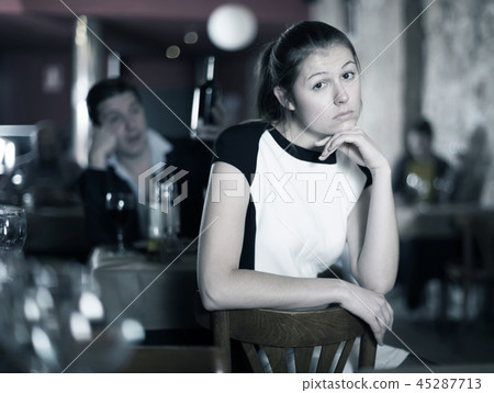 Woman unhappy because her boyfriend drinking in cafe 45287713