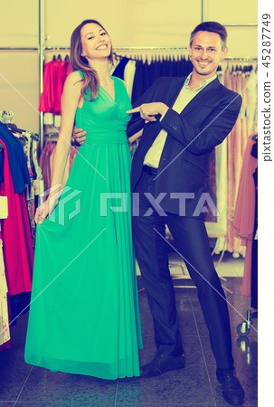 pair of young active people in women clothes boutique pair of young active people in women clothes boutique 45287749