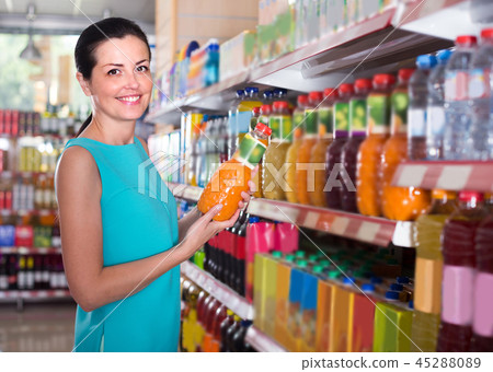 Woman is holding bottle with juice 45288089
