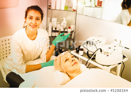 Woman making beauty procedures for face 45288164