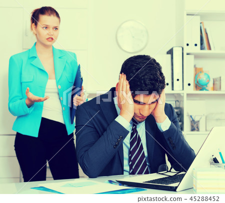 Frustrated businessman with angry chief Frustrated businessman with angry chief 45288452