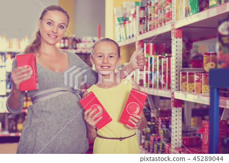 Mother with daughter are satisfied after buying Mother with daughter are satisfied after buying 45289044