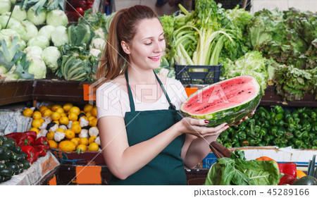 seller woman is demonstraiting watermelon seller woman is demonstraiting watermelon 45289166