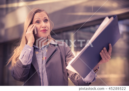 Professional woman talking on the phone Professional woman talking on the phone 45289322