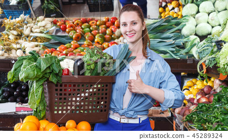 Woman is choosing vagetables with basket Woman is choosing vagetables with basket 45289324