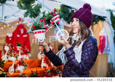 Girl shopping at festive fair before Xmas 45289358