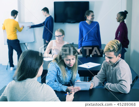 Girl consulting fellow student 45289368