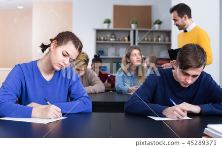 Girl student is trying to ask the question about exercise Girl student is trying to ask the question about exercise 45289371
