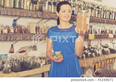 Woman choosing herbs and spices 45289671