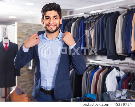 Visitor is trying on jacket Visitor is trying on jacket 45289734