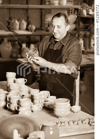 Happy potter at the workshop Happy potter at the workshop 45289772