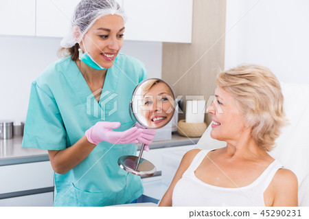 Satisfied female patient in esthetic clinic Satisfied female patient in esthetic clinic 45290231