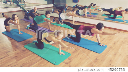 People relaxing and enjoying yoga People relaxing and enjoying yoga 45290733