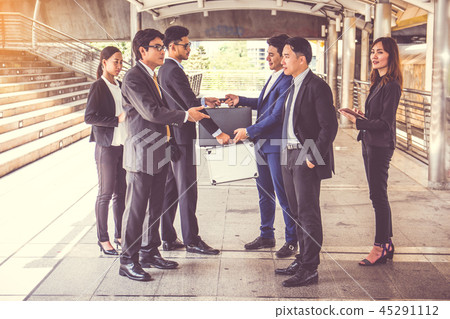 businesspeople group handshake at city, businesspeople group handshake at city, 45291112
