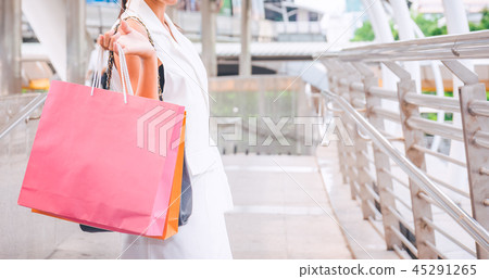 Happy woman with shopping bags enjoying in shop Happy woman with shopping bags enjoying in shop 45291265