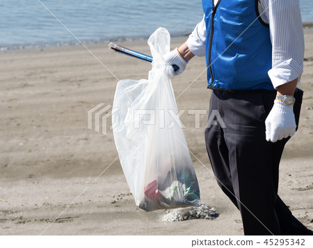 Garbage pick up on the beach 45295342