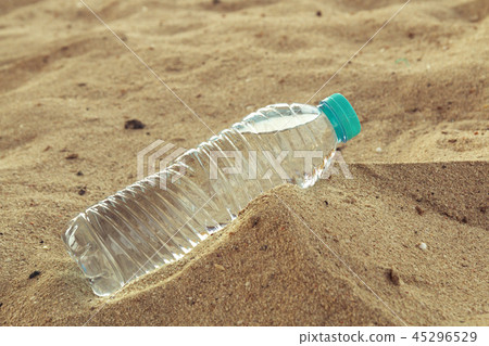 Bottle of clean drinking water in a dry desert, copy space. Bottle of clean drinking water in a dry desert, copy space. 45296529