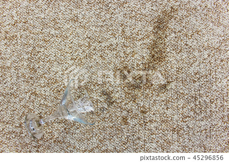 Glass of with alcoholic cocktail fell on carpet. Glass of with alcoholic cocktail fell on carpet. 45296856